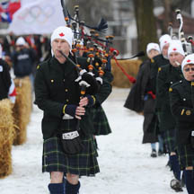 Bagpipes parade into the Picton fairgrounds at the Olympic Torch Relay celebration.